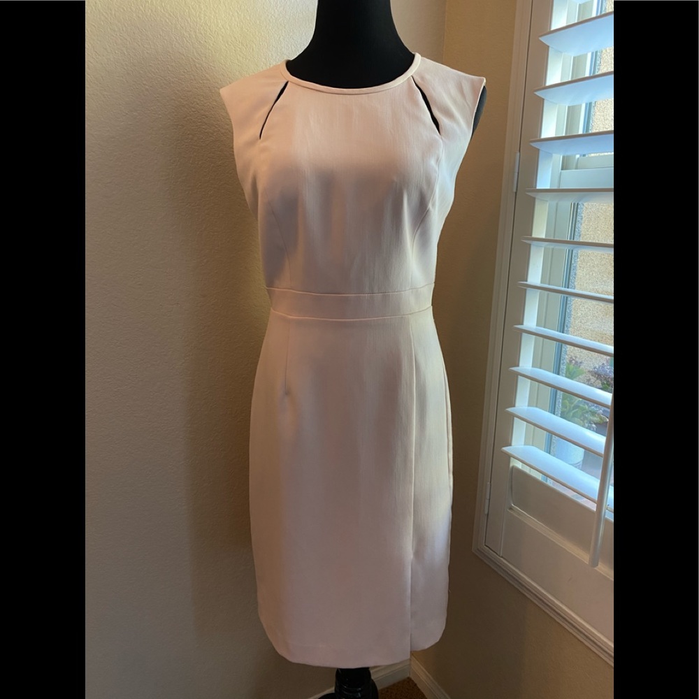 Fitted shift dress with shoulder slits.